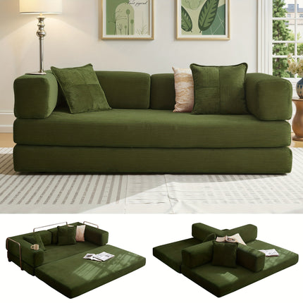 Green sofa bed in a living room setting with pillows and a lamp.