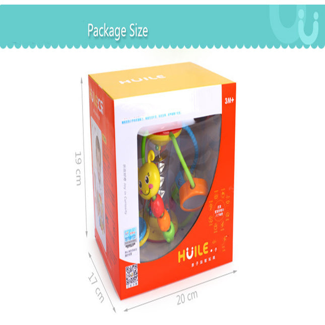 Baby hand holding rattle ball toy