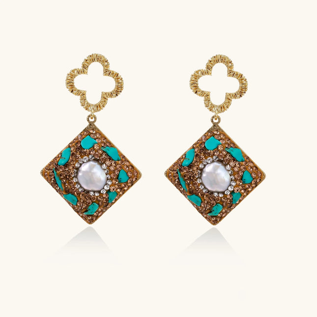 Gold-plated drop earrings with quatrefoil studs, diamond-shaped pendants featuring baroque pearls, turquoise stones, and amber crystals