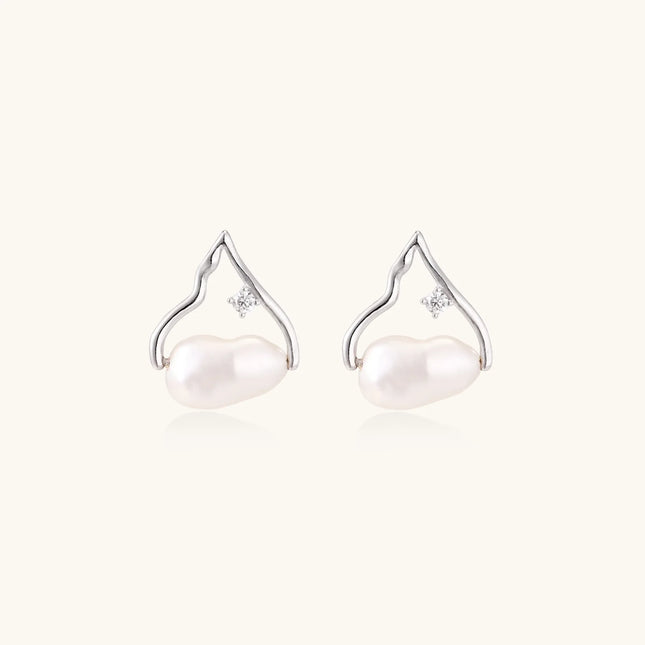 Silver mountain outline studs with baroque pearl and diamond accent on white background