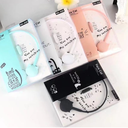 Kitten, ear, wearing headphones