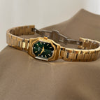 Gold Strap Green Surface