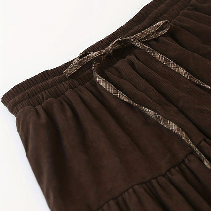 A Thick Patchwork Midi Skirt with a Pocket, Featuring a Corduroy Checkered Design And a Tie