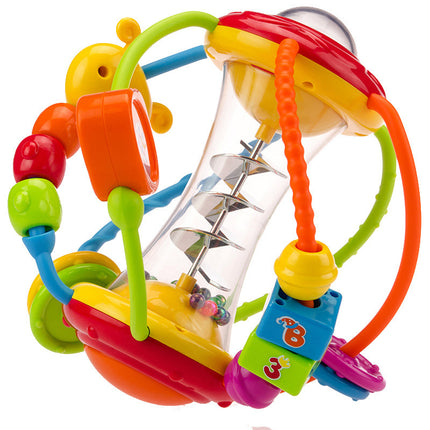 Baby hand holding rattle ball toy