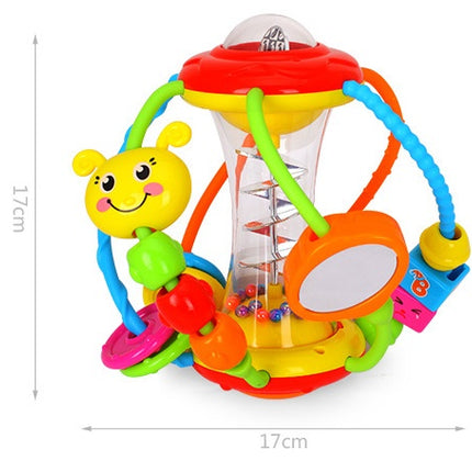 Baby hand holding rattle ball toy