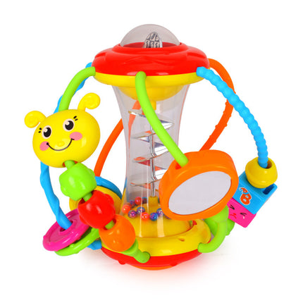 Baby hand holding rattle ball toy