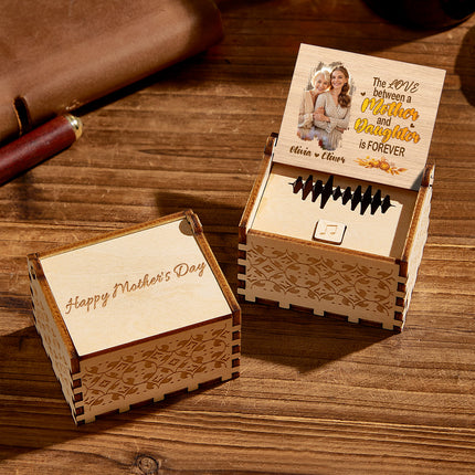 Personalized wooden music box for Mother's Day with engraved "Happy Mother's Day" and photo.