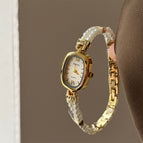 Gold Strap White Surface