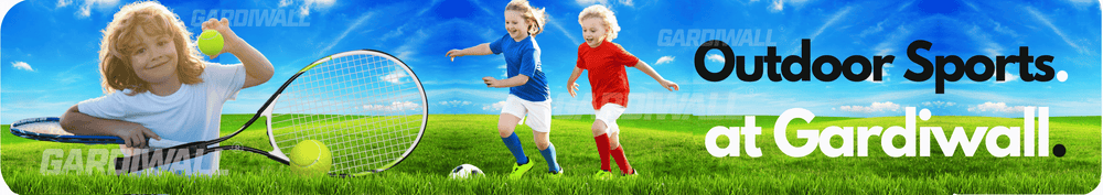 Children playing outdoor sports with tennis rackets and soccer balls on a grassy field, with a blue sky and clouds in the background.