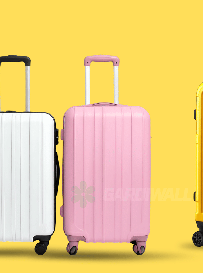 Four suitcases in white, pink, yellow, and purple on a yellow background with colorful accents.
