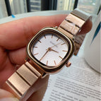Rose Gold Strap White Surface