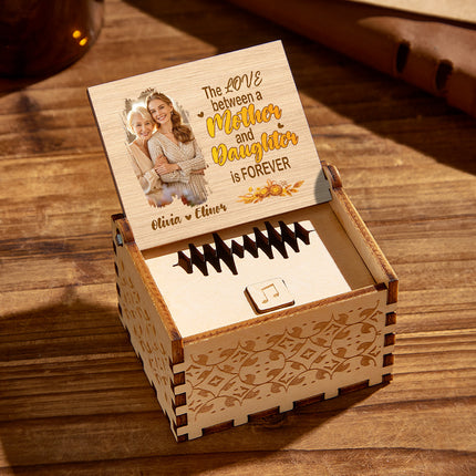 Personalized wooden music box for mother and daughter. Engraved photo and message.